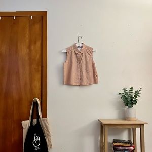 Everlane- Sleeveless button down collared shirt.